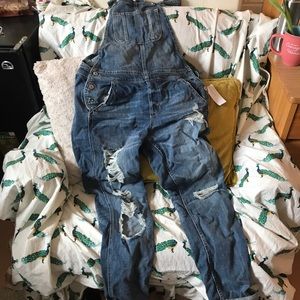 Full length, ripped overalls